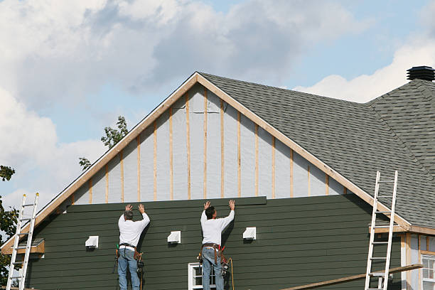 Professional Siding Installation technician working in Topping, VA